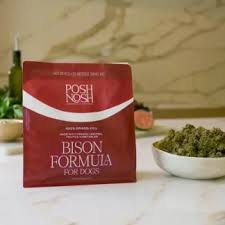 Dog owner checking Posh Nosh dog food ingredients